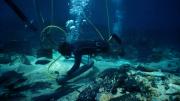 Diver operating machinery at a wreck site